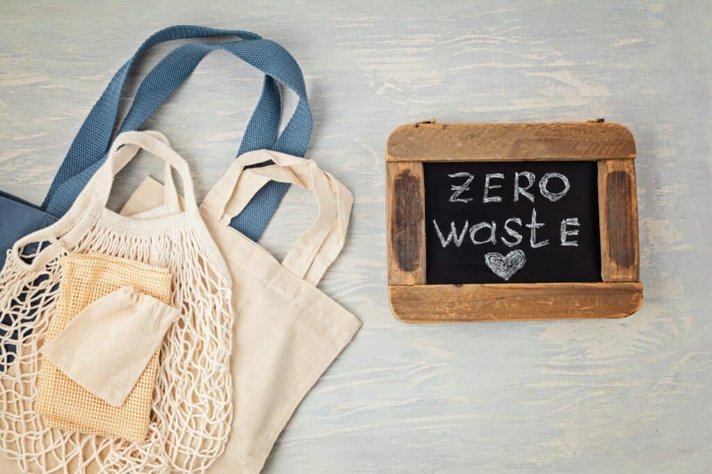 Flat lay of Zero waste kit. Set of eco friendly reusable mesh cotton bag. Sustainable, ethical