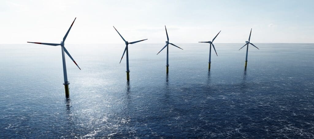 Offshore wind turbines farm on the ocean. Sustainable energy